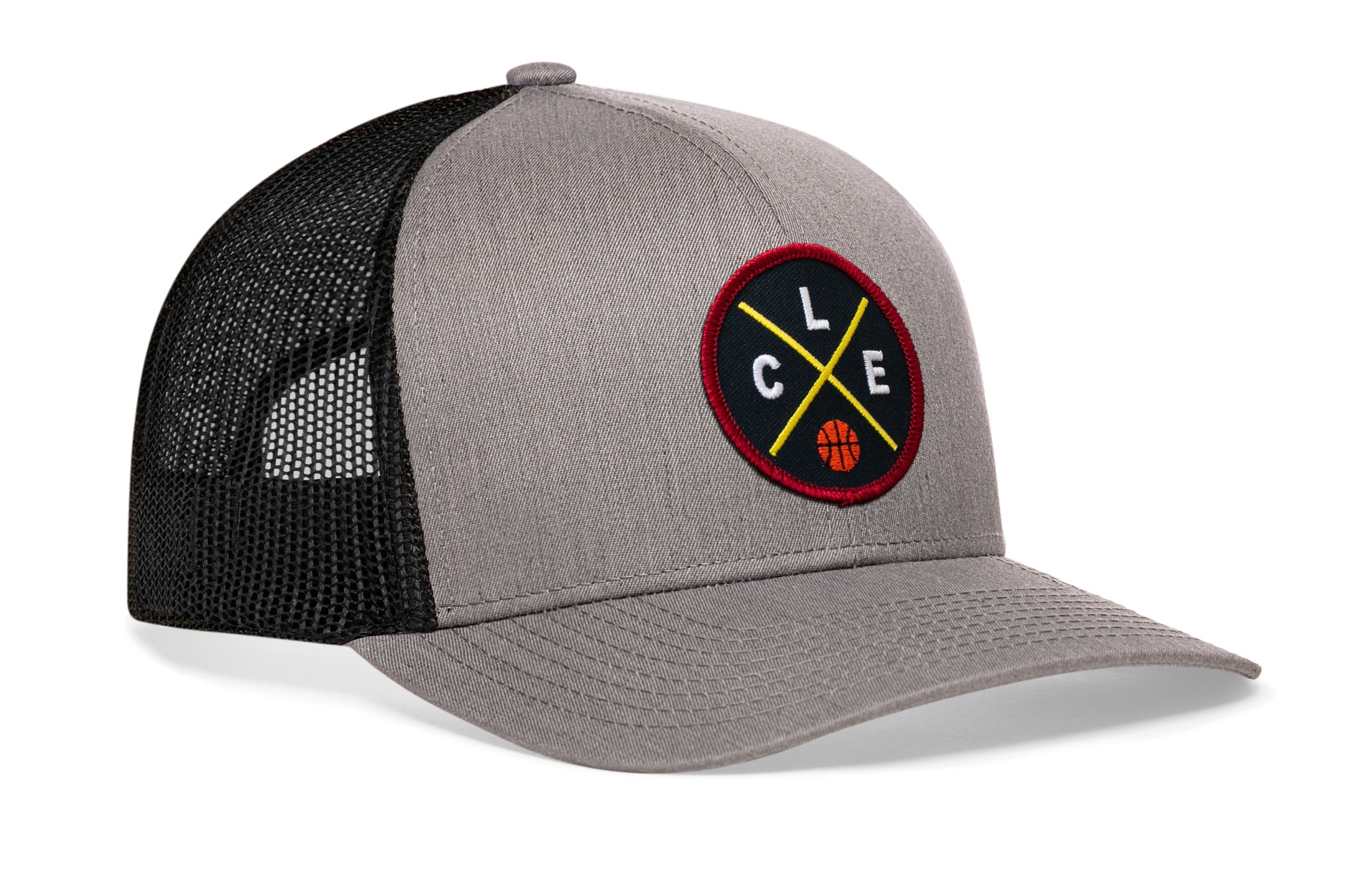 Gray trucker cap with black mesh back and circular logo patch on the front