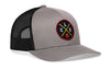 Gray trucker cap with black mesh back and circular logo patch on the front