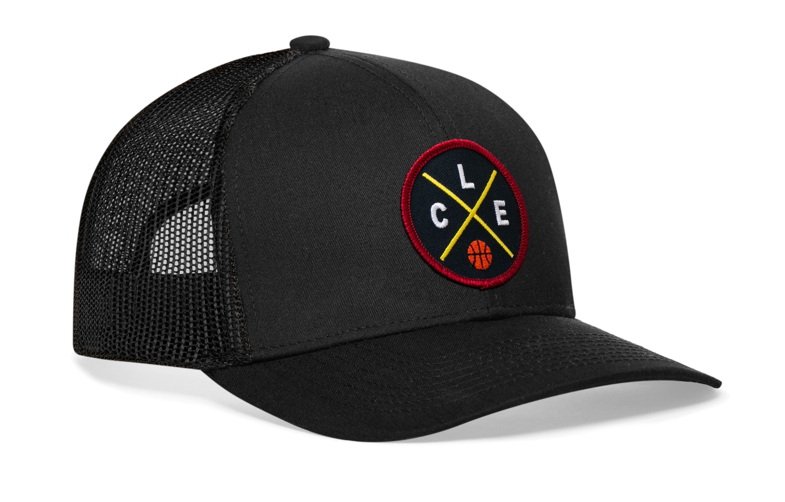 Black trucker cap with mesh back and circular logo patch on the front