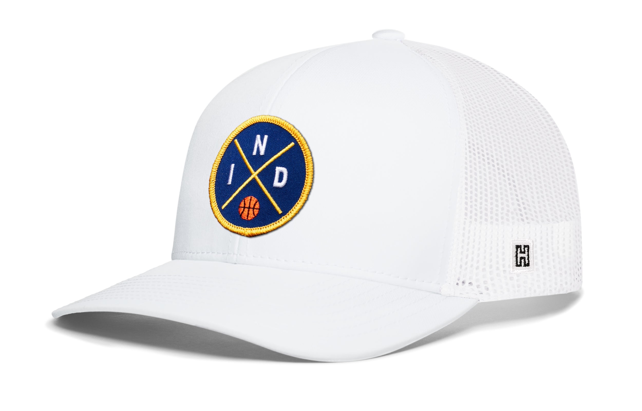 White trucker snapback hat with front circular logo patch and mesh back panel.
