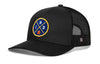 Black trucker snapback hat with front circular logo patch and mesh back panel.