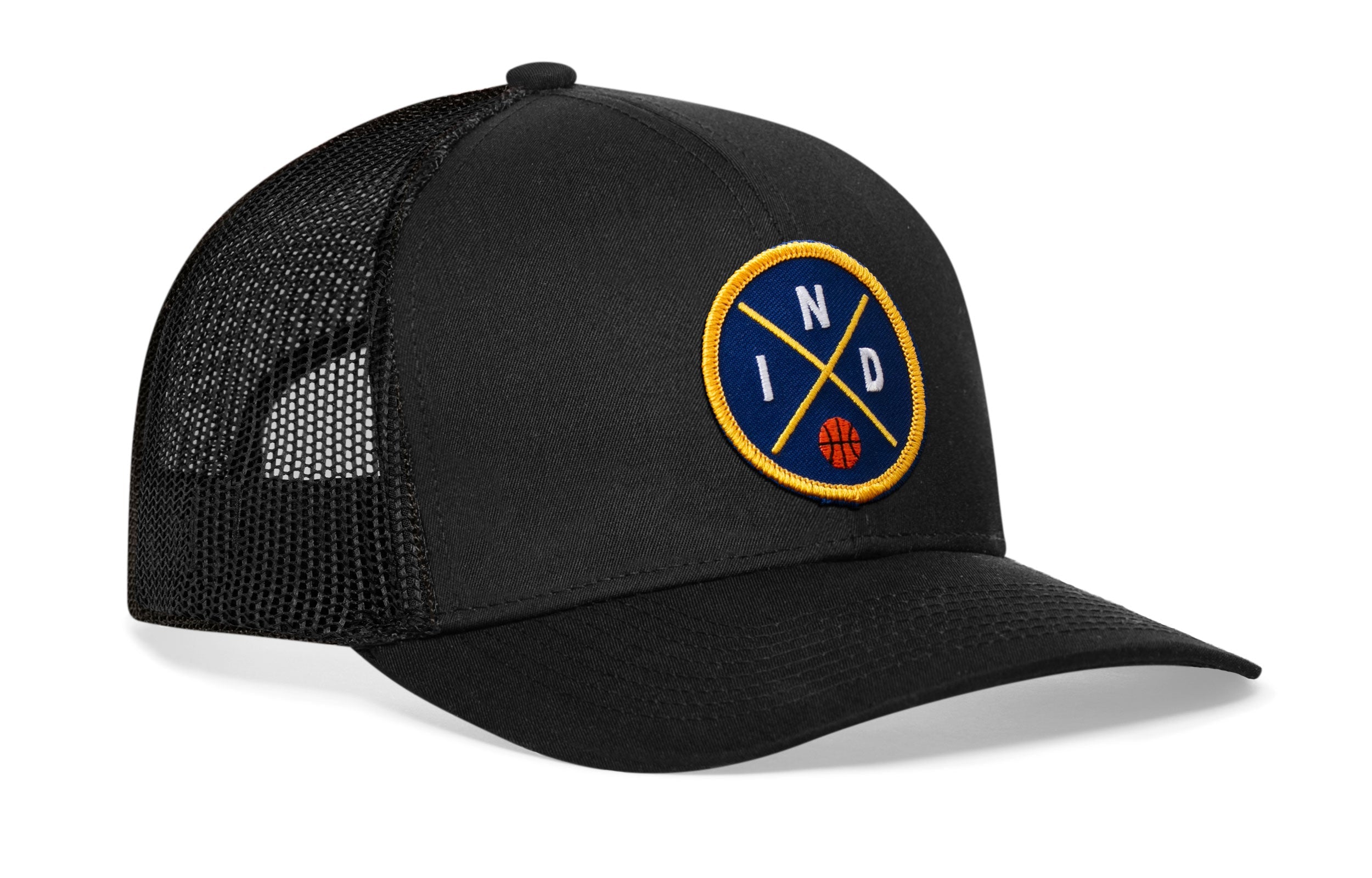 Black trucker snapback hat with front-right circular logo patch and mesh back panel.