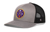 Gray and black trucker hat with circular LA graphic patch on front