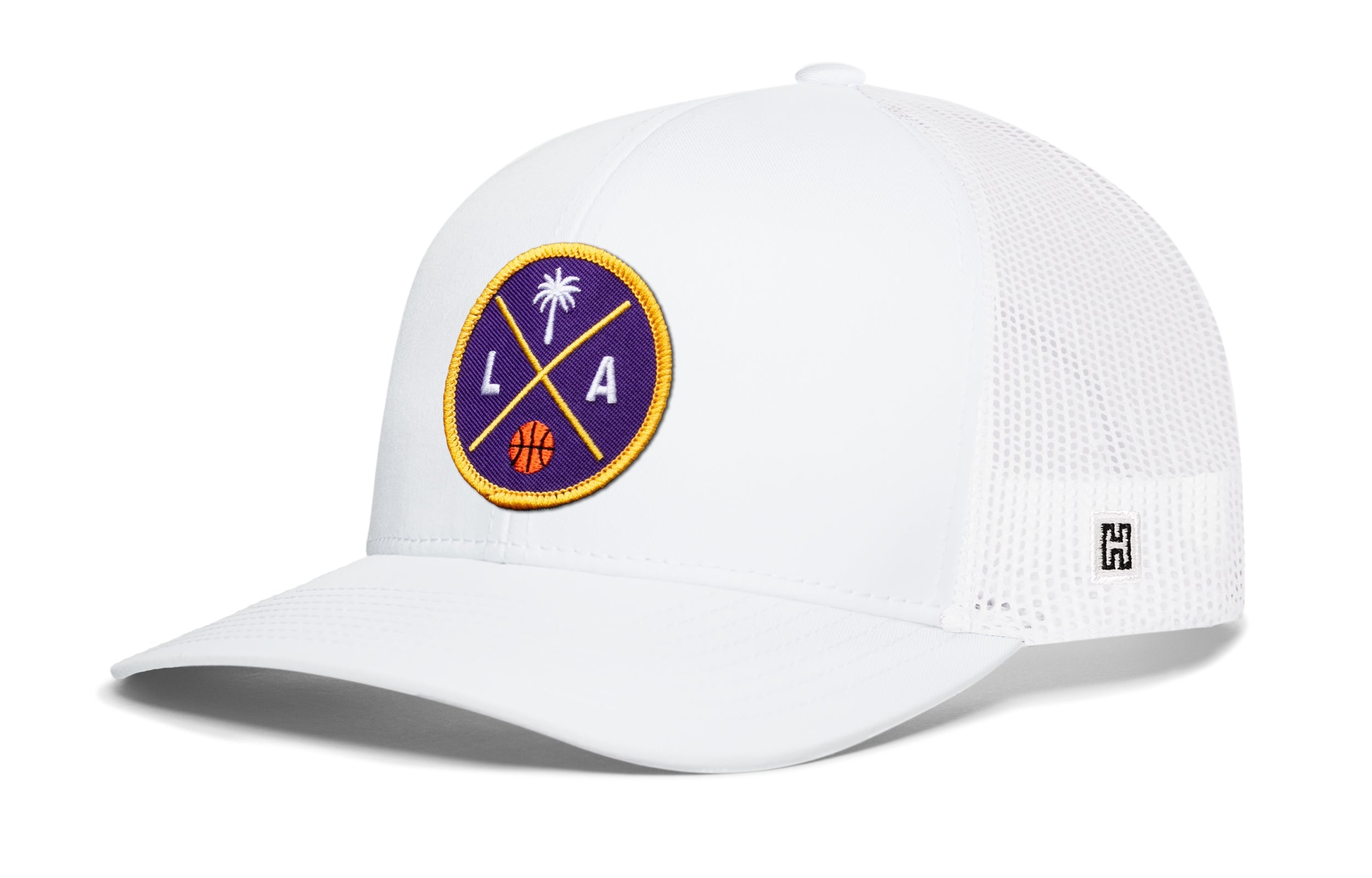 White basketball trucker hat with circular LA graphic patch and side H logo