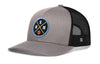 Gray and black basketball trucker hat with circular EMM logo patch and mesh back
