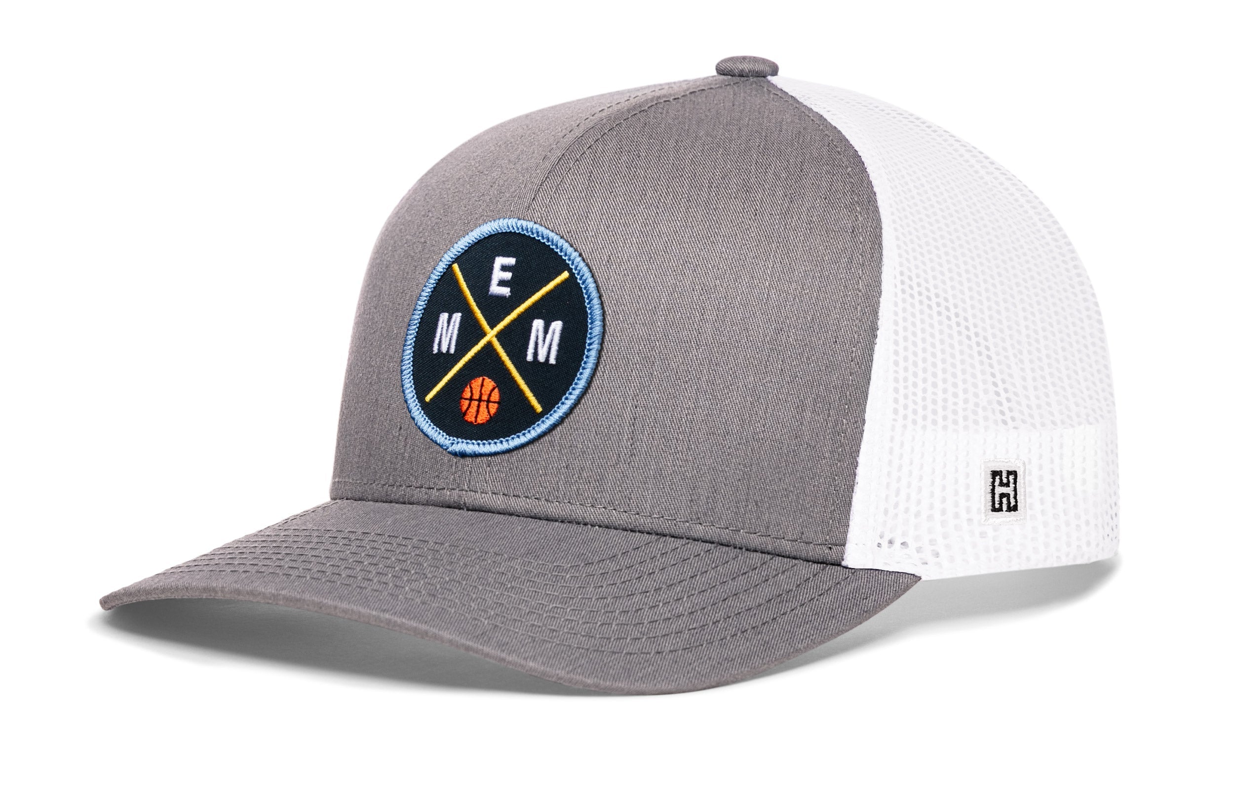 Gray basketball trucker hat with circular EMM logo patch and white mesh back