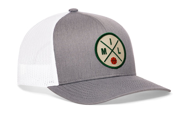 Gray-and-white trucker cap with snapback, mesh sides, green front logo patch