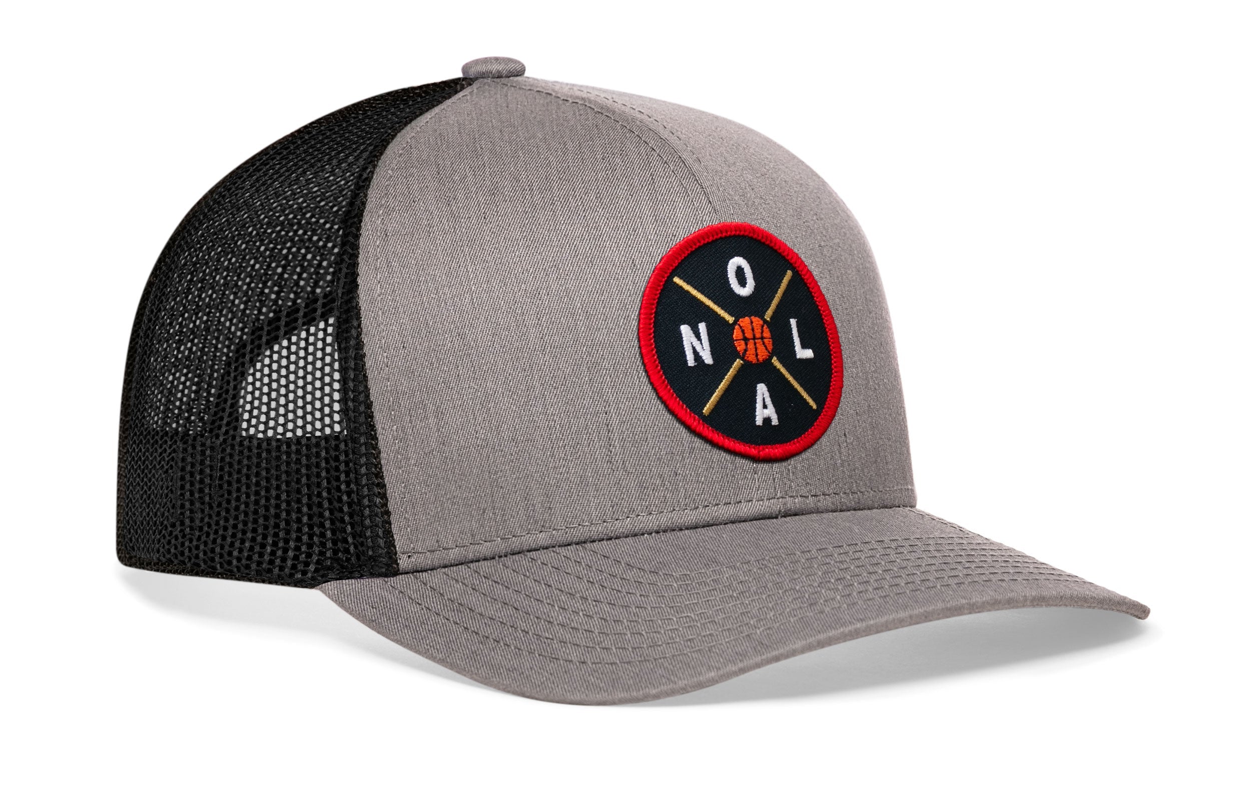 Gray basketball trucker hat, side view, black mesh back and red logo patch