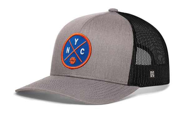 Gray front basketball trucker cap with black mesh back, blue-and-orange NYC patch
