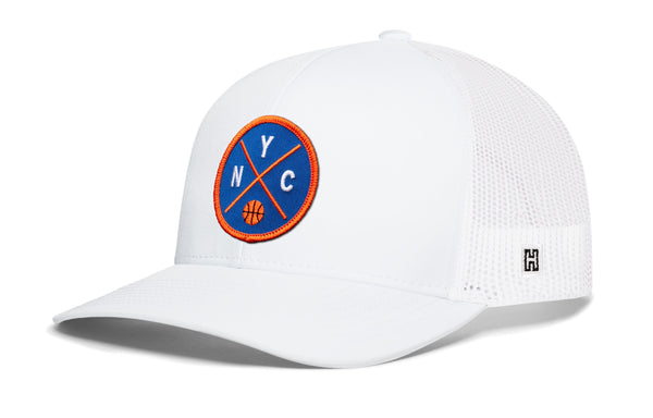 White basketball trucker cap with blue-and-orange NYC patch, mesh back and curved brim