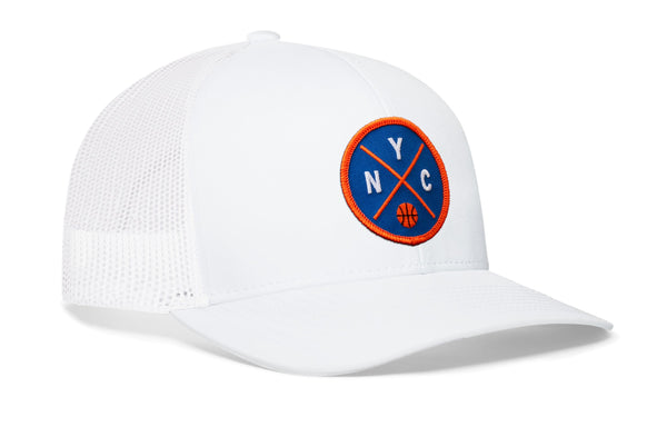 White basketball trucker cap with blue-and-orange NYC patch, mesh back and curved brim