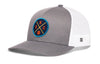Gray and white trucker hat with mesh sides, curved brim, and circular team logo patch.