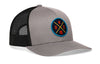 Gray and black trucker hat with mesh sides and circular team logo patch on the front.