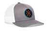 Gray and white trucker hat with mesh sides and circular team logo patch on the front.