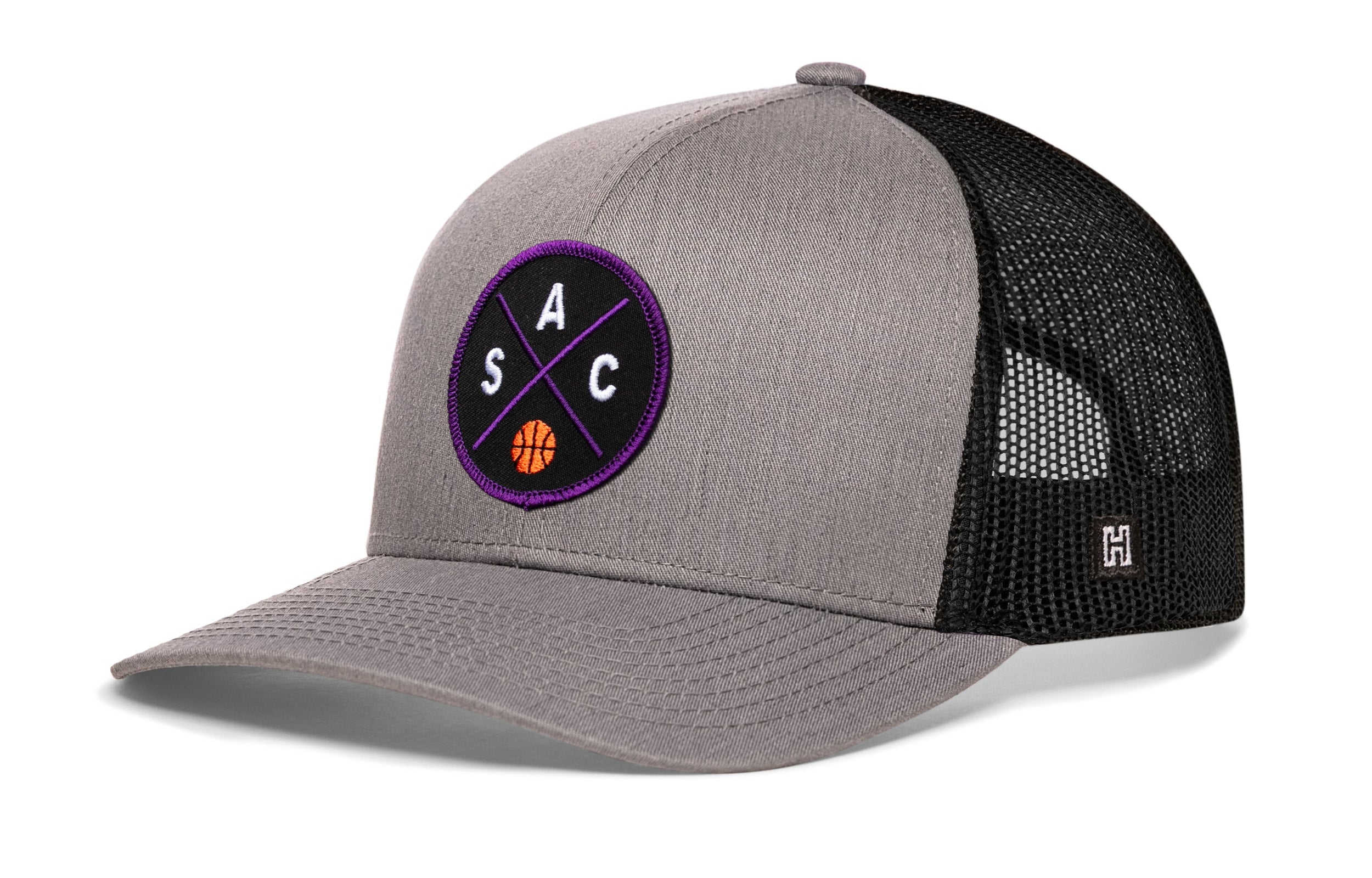 Gray and black basketball trucker hat with mesh back and purple circle logo on front