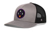 Gray and black basketball trucker hat with mesh back and purple circle logo on front