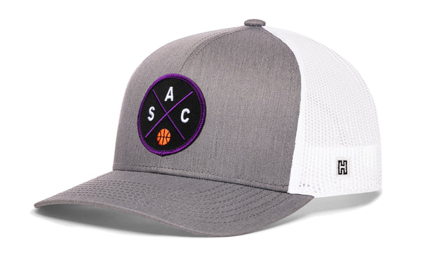 Gray and white basketball trucker hat with mesh back and purple circle logo on front, side H patch