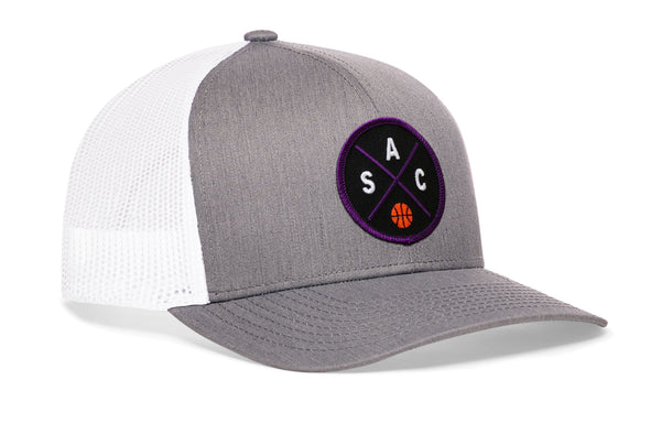 Gray and white basketball trucker hat with mesh back and purple circle logo on front