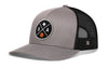 Gray trucker hat with black mesh back, front circular SA graphic patch, and side H logo