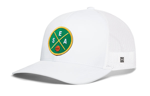 White trucker hat with circular basketball logo patch and H logo on mesh side