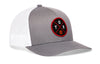 Gray front/white mesh basketball trucker hat with circular logo patch, angled view.