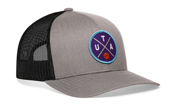 Gray trucker snapback hat with blue logo patch and black mesh back