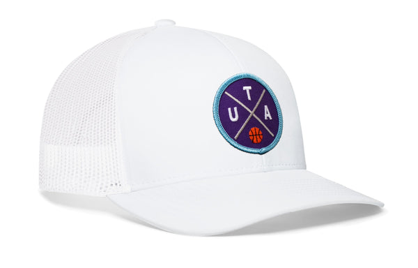 White trucker snapback hat with blue logo patch and white mesh back