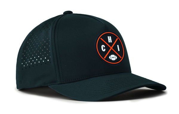Navy 5-panel snapback hat, angled view with CHI emblem patch and perforated side