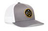 Two-tone gray and white hockey trucker hat with snapback, front patch logo and mesh back