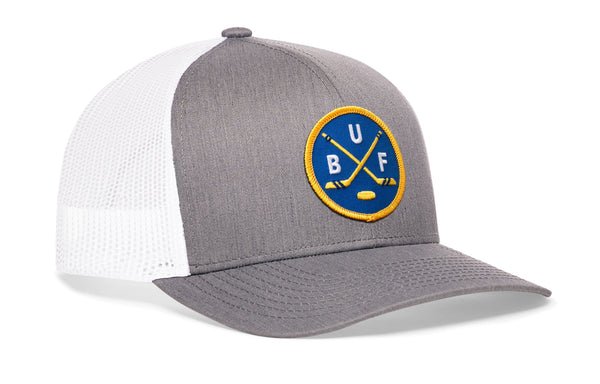 Gray-and-white Buffalo hockey trucker hat with snapback, front round patch logo