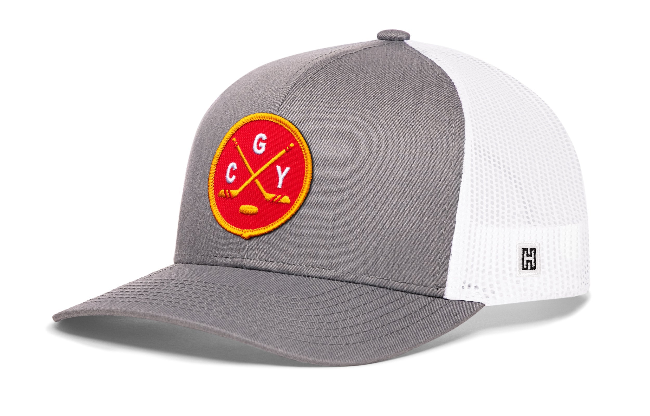 Gray-and-white trucker snapback hat with circular “CGY” patch and mesh sides.