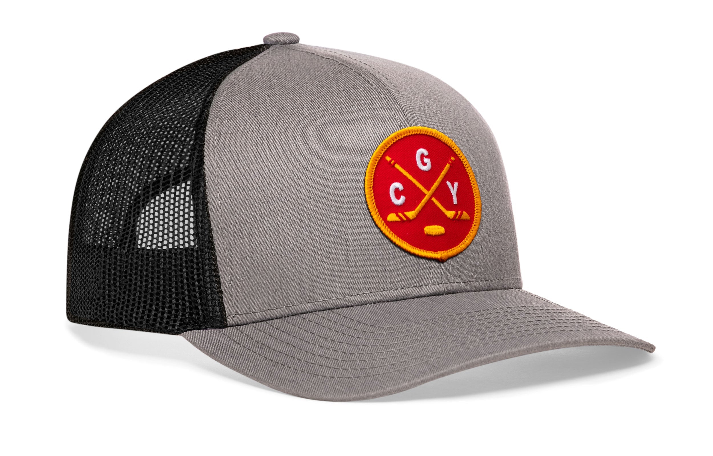 Gray trucker hat with circular “CGY” patch, black mesh side panels, curved brim.