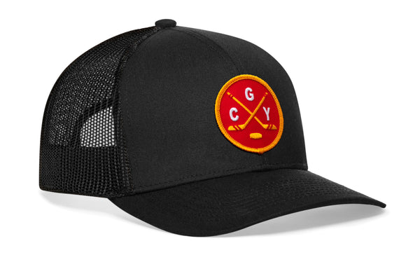 Black trucker hat with circular “CGY” patch, curved brim, and side mesh panels.