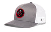 Gray trucker cap with white mesh side panels and red-and-black circular front emblem.