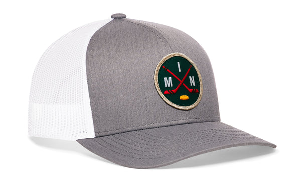 Gray front trucker hat with white mesh back and round hockey logo patch, snapback.