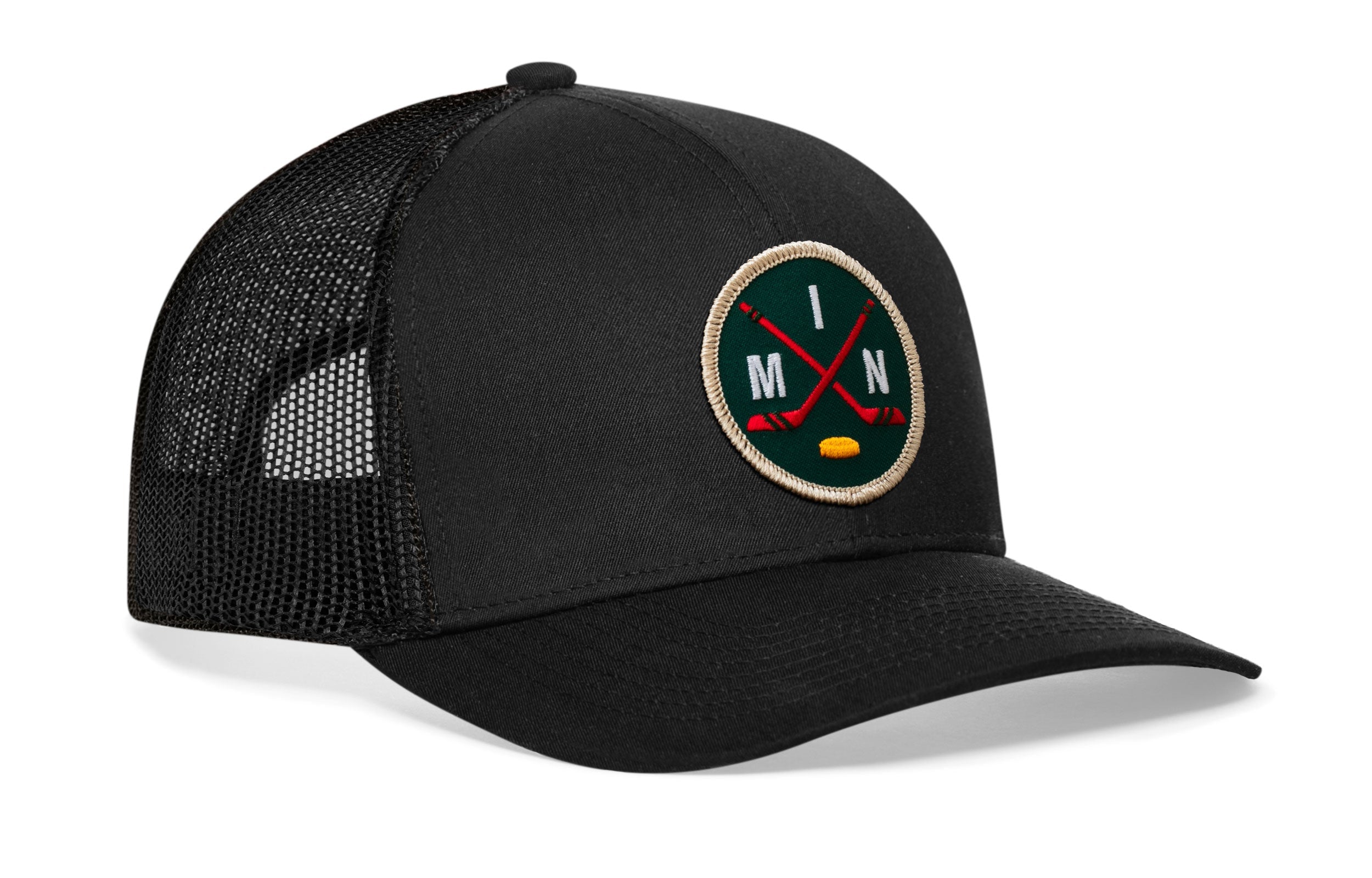 Black mesh trucker hat with round hockey logo patch on front panel and curved brim.