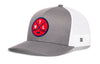 Gray trucker hat with white mesh sides, curved brim, and red circular crest patch on front