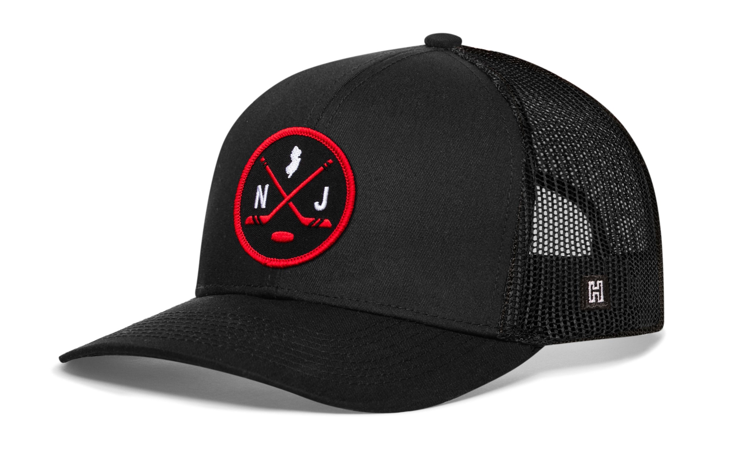 Black hockey trucker cap with red logo patch, mesh side panels, snapback strap