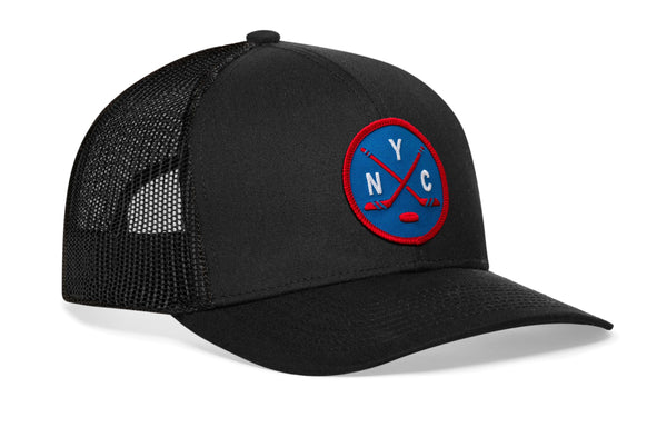 Black hockey trucker hat, circular logo patch on front, breathable mesh side panels.