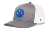 Gray-and-white hockey trucker cap with blue front logo patch and white mesh sides, curved brim