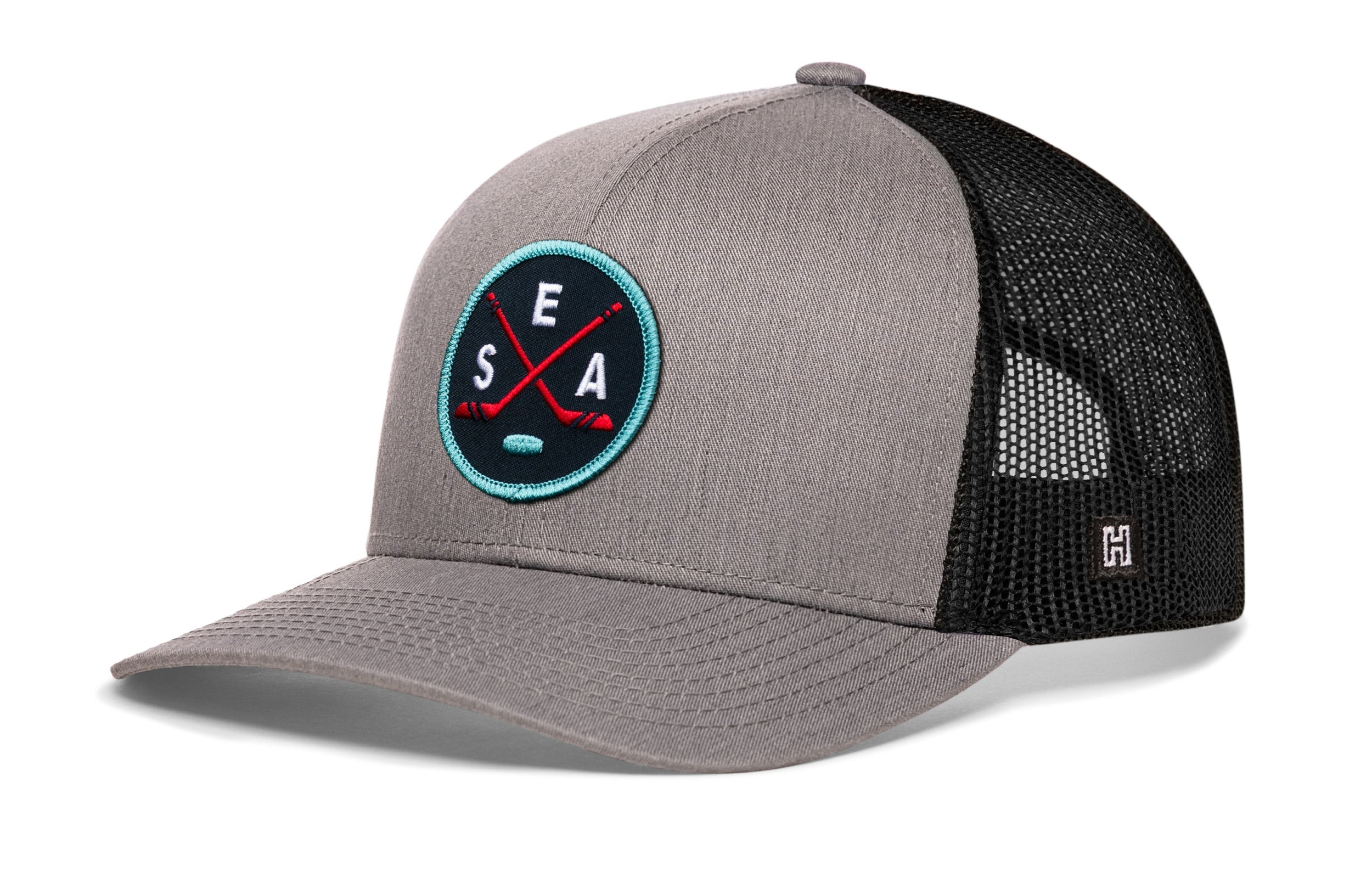 Gray snapback trucker hat with black mesh back and circular SEA X logo patch