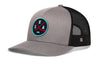Gray snapback trucker hat with black mesh back and circular SEA X logo patch