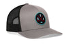 Gray trucker hat with black mesh sides, curved brim, and SEA X logo patch