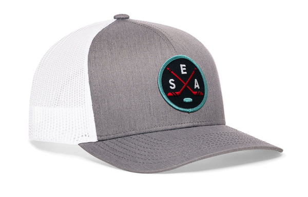 Gray trucker hat with white mesh sides, curved brim, and SEA X logo patch