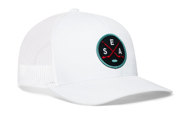 White trucker hat with white mesh sides, curved brim, and SEA X logo patch