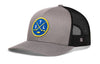 Gray trucker hat with mesh side panels and circular STL logo patch.