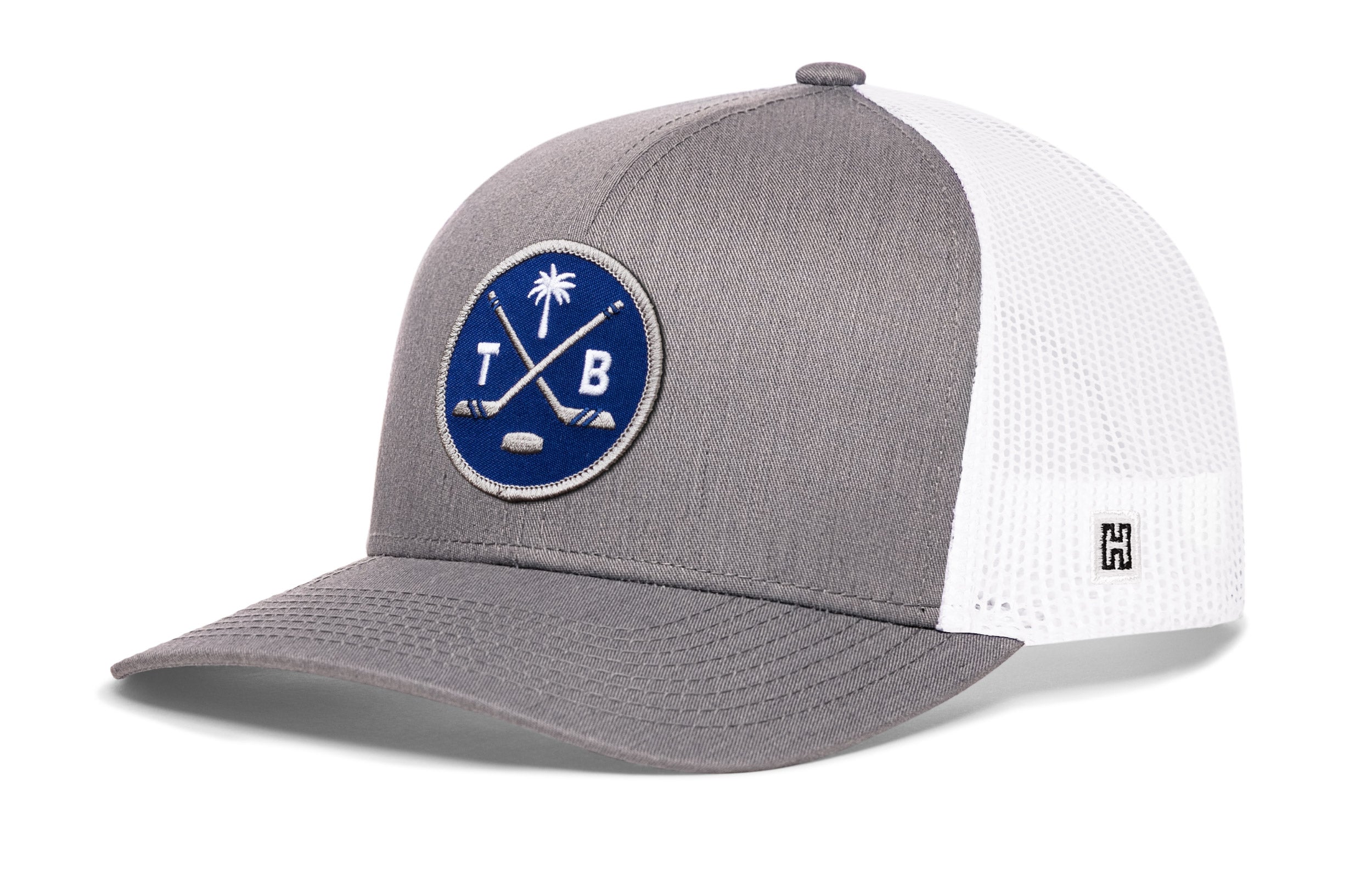 Gray trucker hat with blue circular logo patch and white mesh side panels
