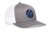 Gray front trucker cap with blue circular logo patch and white mesh side panels