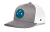 Gray front trucker snapback cap with green logo patch and white mesh side panels