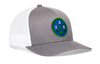 Gray and white trucker snapback cap with green logo patch and white mesh back